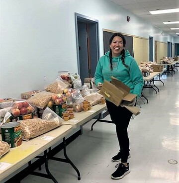 Calling Lake School teachers organizing snack boxes for students!