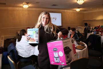 Anzac School - Bill Woodward School Vice-Principal Amy Savill showcasing the Instant Pot she won for the school!