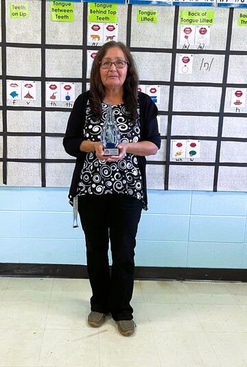 Lorraine Risdale holding the award she was presented with by the Métis Settlements General Council